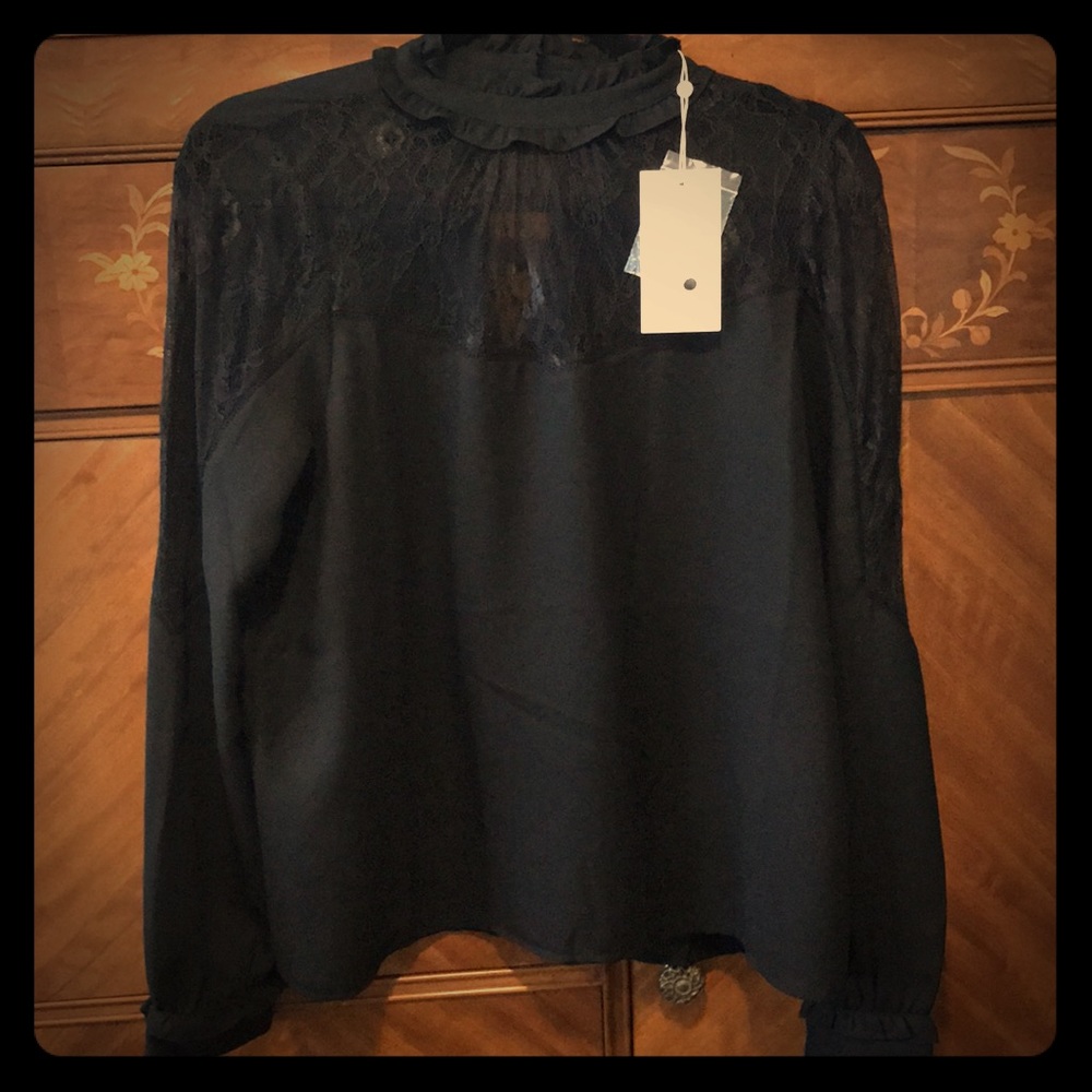 Never worn, vintage-looking black shirt.